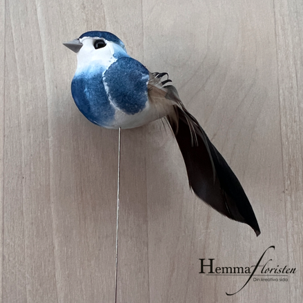 Fågel på pinne blå